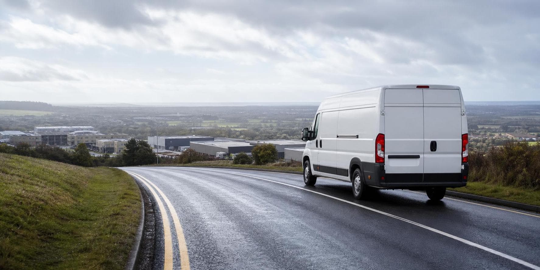 Courier handling a prepared consignment in Biggin Hill, with airport-adjacent businesses, workshops and semi-rural properties forming the local backdrop